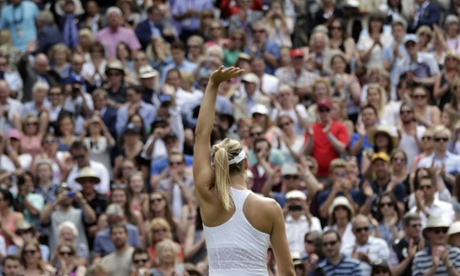 Maria Sharapova waves to the crowd as she celebrates winning her singles match against Coco Vandeweghe.