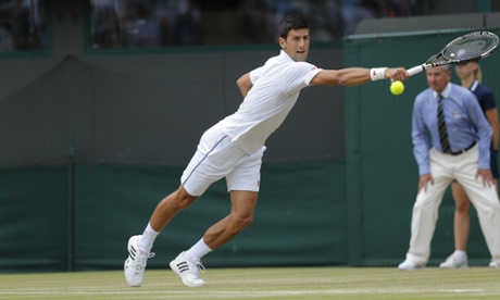 Novak Djokovic attempts to return the ball to Kevin Anderson.