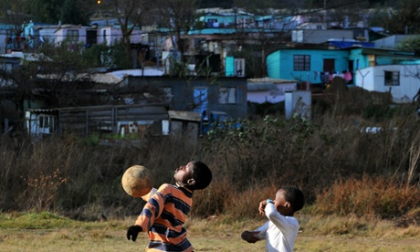 Children playing football.
