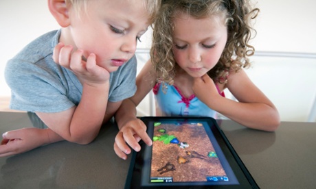 Children playing computer game on an iPad tablet 
