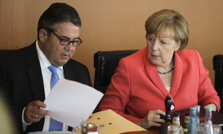 German chancellor Angela Merkel and vice chancellor and economy minister Sigmar Gabriel  attend  the weekly cabinet meeting at the chancellery in Berlin on Wednesday.