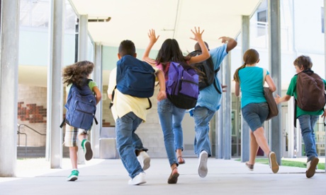 Children running in school corridor