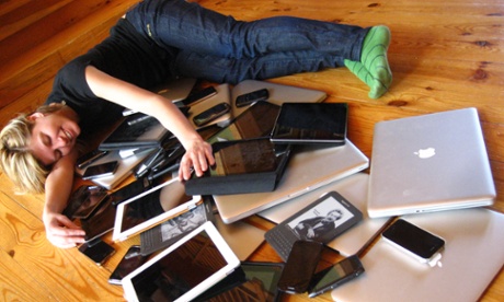 woman cuddling multiple computer mobile devices