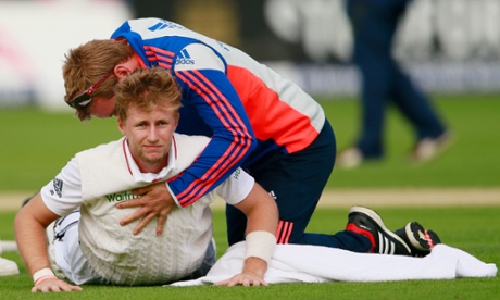 Joe Root receives treatment on his back during the drinks break.