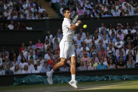 Novak Djokovic plays a forehand.