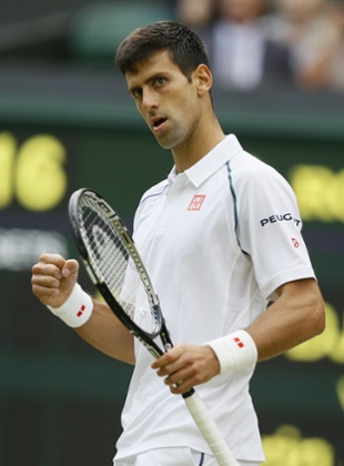 Novak Djokovic celebrates breaking the serve of Marin Cilic.