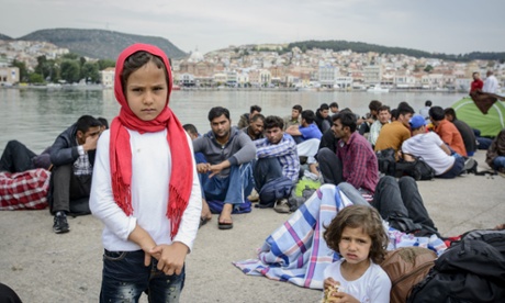 Newly arrived refugees wait to be registered in Mytilini harbour, Lesbos.