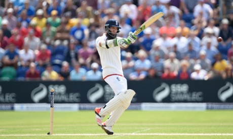 Moeen Ali thumps the ball away.