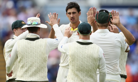 Well done big man. Mitchell Starc receives his team-mates congratulations.
