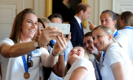 England's Karen Bardsley (left) takes a selfie in front of Prince William at Kensington Palace.