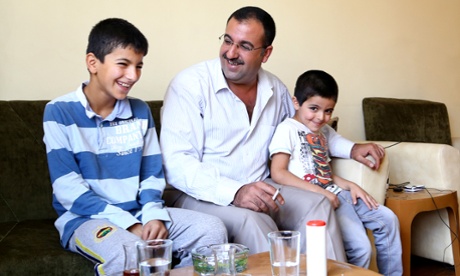 Abu Shujaa shares a light moment with his sons Hassan (left) and Shujaa in Iraqi Kurdistan.