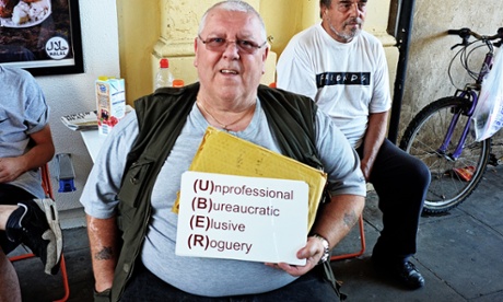 A protester holds an anti-Uber sign during a United Cabbies Group (UCG) demonstration last month.