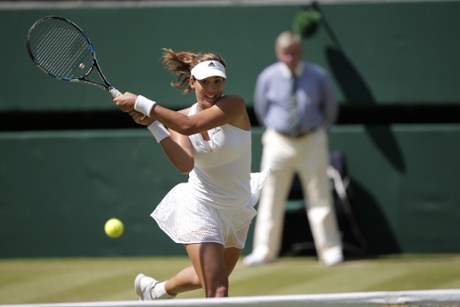 Garbine Muguruza returns and gets the decisive break against Agnieszka Radwanska.