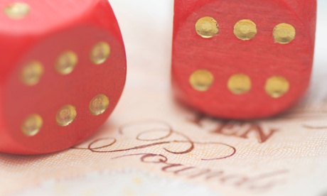 two dice on a ten pound note