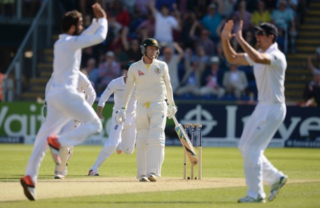 Michael Clarke looks dejected after being caught and bowled as Ali celebrates with Alastair Cook.