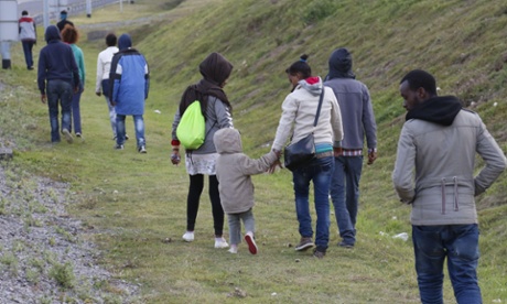 Women and children among the people hoping to make it out of the camp.
