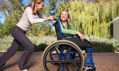 ARB2W5 Girls Outdoors10-11yearold6-7yearoldfamily7-8yearold29-10yearoldpeople11-12yearoldgirlsmilehappysummerlifestylechildtablewhitefemalekidwheelchairtworelationshiplivingsittingrespectoutdoorslivebondpushingdayexteriorblondbondingsi