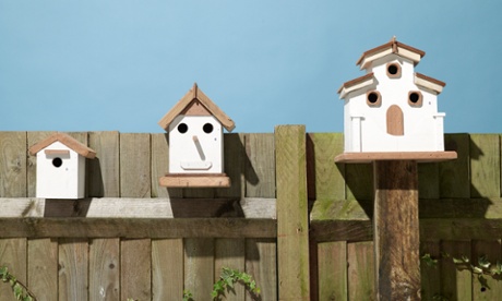 Birdhouses on a fence