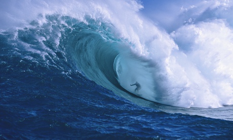 Surfer shooting the curl of Jaws at Peahi on Maui