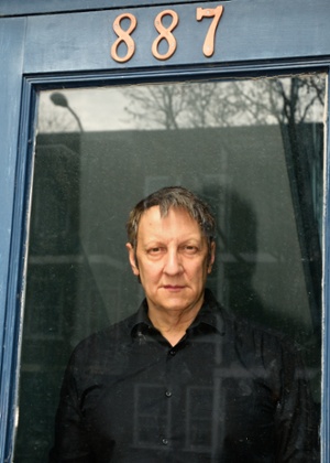 Lepage at the door of his childhood home in Quebec.