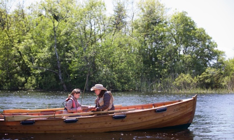 Annalisa teaches her daughter the basics of fishing.