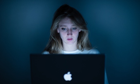 young woman looking at computer