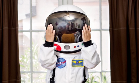 Child in a mini astronaut suit