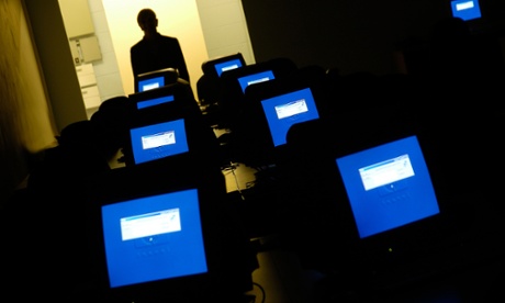 Computer screens in empty room