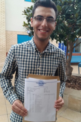 Hassan Al-Sherbaz, 18, celebrating his four A*s at A Level