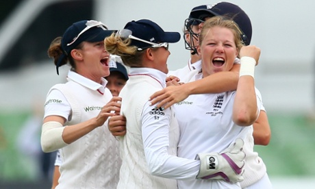 England's Anya Shrubsole, right, celebrates with her team-mates after taking the wicket of Ellyse Perry.
