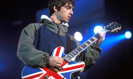 Noel Gallagher plays his union jack guitar.