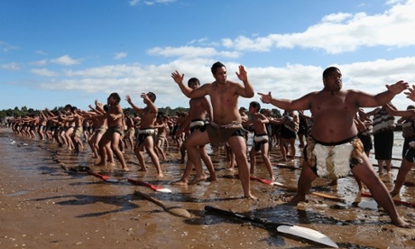 Hundreds of Waka Ama crew perform the haka on the beach to celebrate Waitangi Day in Waitangi, New Zealand.  The Waitangi Day national holiday celebrates the signing of the treaty of Waitangi on February 6, 1840 by Maori chiefs and the British Crown, that granted the Maori people the rights of British Citizens and ownership of their lands and other properties.