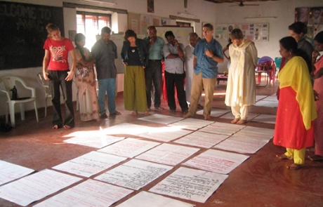 Group of people writing a logframe.