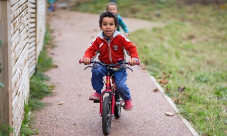 Children playing on their bikes at Lilac Grove in Leeds.