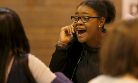 A student reacts after receiving her A-level exam results at the Harris City Academy in London.