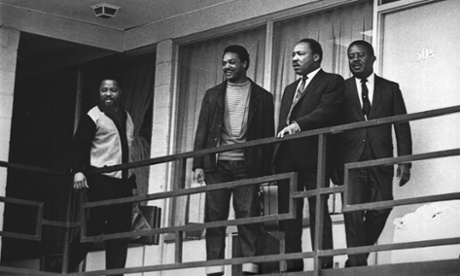 Jesse Jackson (second left) stands next to Martin Luther King on 3 April 1968, on the balcony at the Lorraine Motel where King was assassinated the following day.