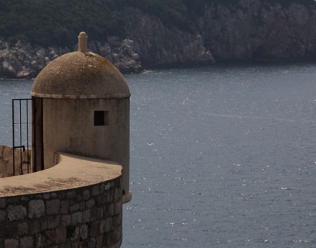 Sentinel. This is simply a guard-post on the city wall of Dubrovnik. But the fact that the window looks as if if might be an eye and the composition to put the guard-post on the left, overlooking the sea, brings the picture unexpectedly to life.