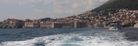 Dubrovnik from the sea. I said wide-angle shots had their place. This was taken on our departure by sea and cropped into a thin strip to accentuate the walled city, nestling at the foot of the mountain slope, with the red roofs just poking out. The boat on the right – a nice, if accidental, touch – adds to the sense of departure.
