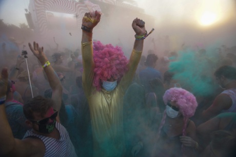 Festival-goers enjoy the Color Party at the 23rd Sziget (Island) Festival on Shipyard Island, northern Budapest, Hungary, Friday, Aug. 14, 2015. (Zoltan Balogh/MTI via AP)