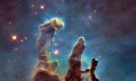 A handout photo released on January 6, 2015 by the NASA/ESA Hubble Space Telescope shows one of its most iconic and popular images revisited : the Eagle Nebulas Pillars of Creation