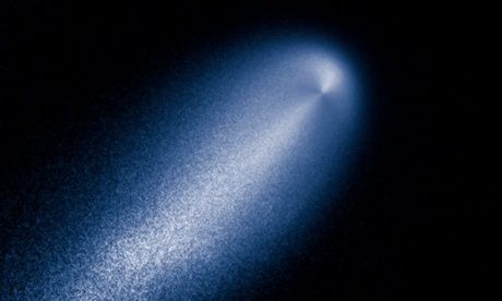 In this photo provided by NASA, a contrast-enhanced image produced from the Hubble images of comet ISON taken April 23, 2013 reveals the subtle structure in the inner coma of the comet. In this computer-processed view, the Hubble image has been divided by a computer model coma that decreases in brightness proportionally to the distance from the nucleus, as expected for a comet that is producing dust uniformly over its surface.