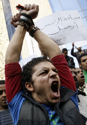 Demonstrators in Cairo in January, 2011. The placard in Arabic reads: 'Mr President, Leave'.