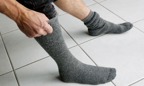 Man pulling up his socks