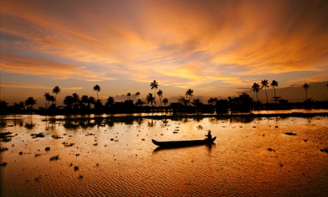 A canoe at dusk in the backwaters of Kerala, India.