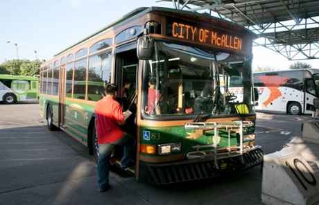 A shuttle bus that takes migrants to Sacred Heats parish hall.