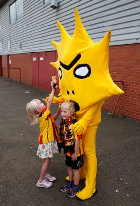 Children play with Kingsley