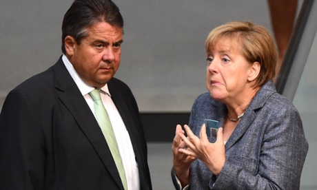 German Chancellor Angela Merkel (R) talks with German Vice Chancellor, Economy and Energy Minister Sigmar Gabriel during a debate ahead of a vote on a third bailout for debt-mired Greece at German lower house of parliament (the Bundestag) in Berlin on August 19, 2015.  AFP PHOTO / JOHN MACDOUGALLJOHN MACDOUGALL/AFP/Getty Images