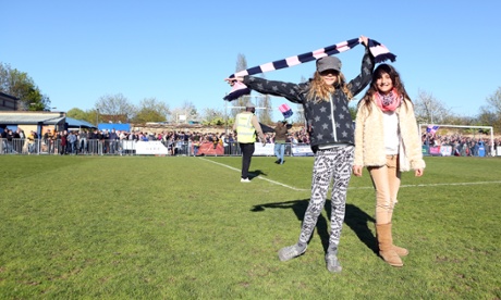 'Every game’s a carnival': supporters walking on the pitch following the final whistle.