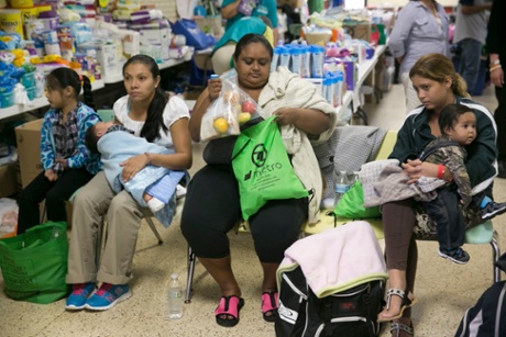 Migrants, mostly women and children are given food, shelter and medical help at Sacred Heart.