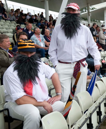 WG Graces in the stand at Edgbaston wait as play is delayed by rain.
